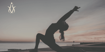 Yoga pose by the sea at a luxury yoga retreat holiday