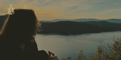 meditating by a lake