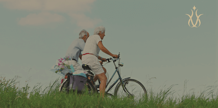 elderly couple with longevity cycling