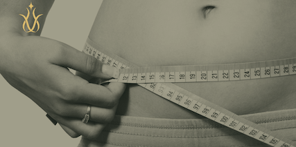 picture of a tape measure around a waist, symbolizing belly fat and weight loss