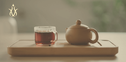 Preparing a cup of hibiscus tea with boiling water and jaggery powder